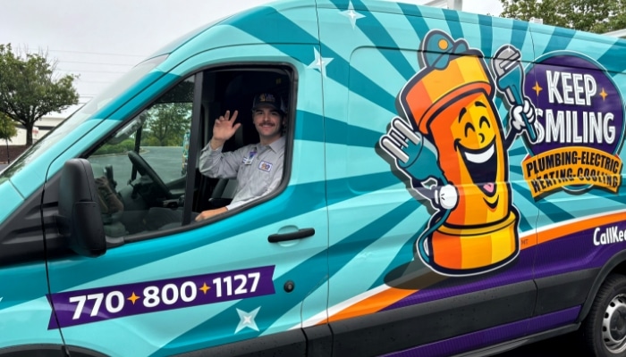 Close Up Technician Waving Ion Van